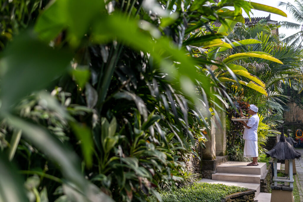 Someone putting offerings on an entrance