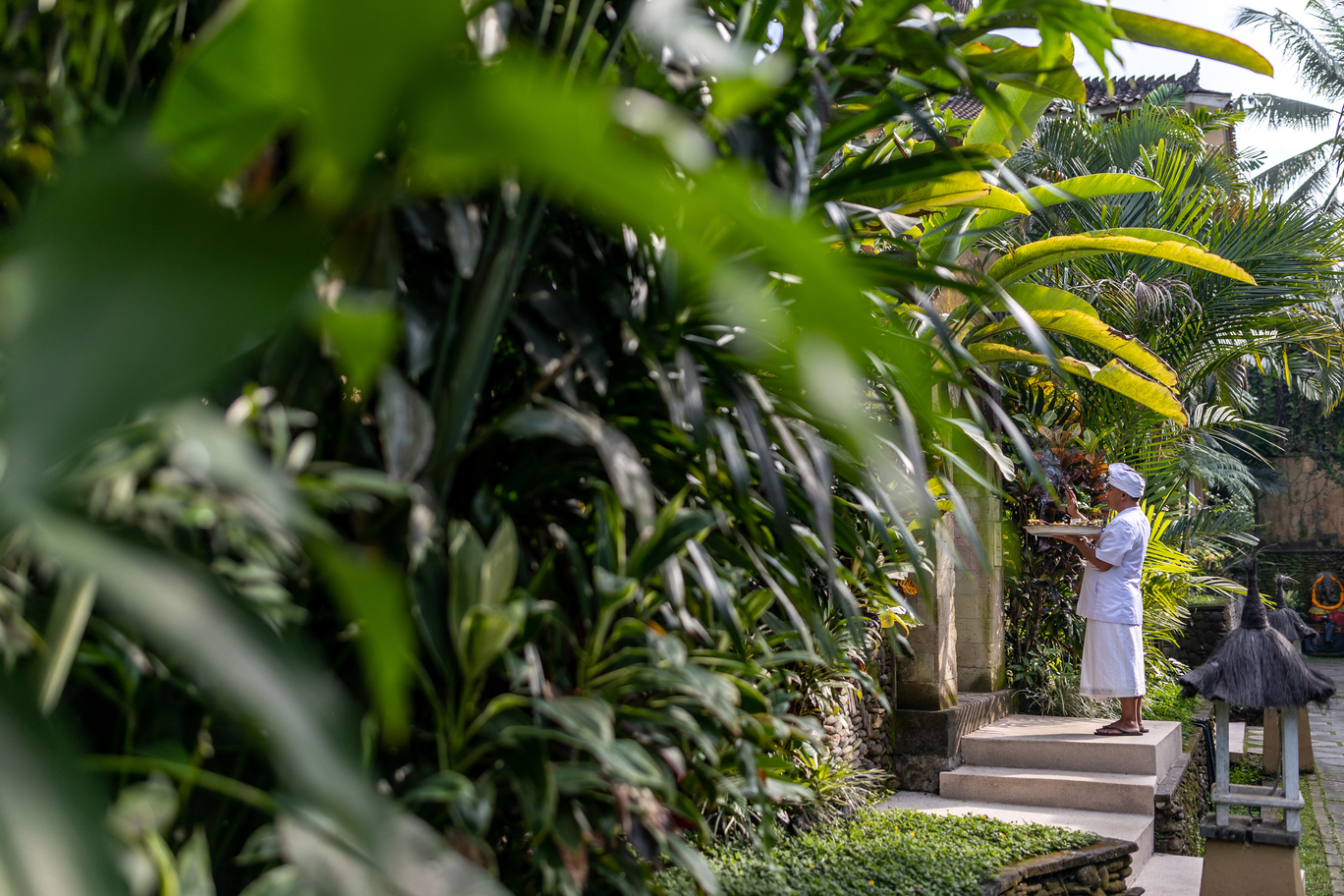Someone putting offerings on an entrance